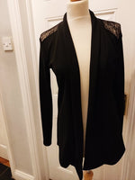 Azalea plain black jacket with lace style uper back and shoulders.