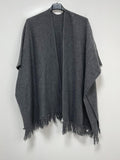 Astie fringed shawl in a  poncho style.